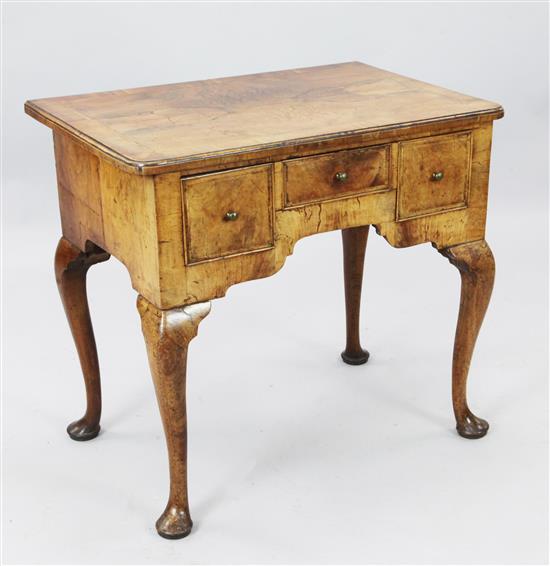 A George II feather banded walnut lowboy, W. 2ft 6in. D. 1ft 8in. H. 2ft 3.25in.